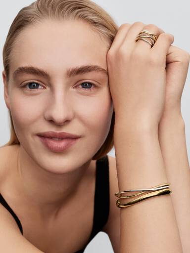Brazalete rígido abierto entrelazado de dos tonos