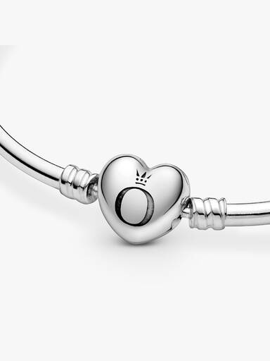 Brazalete rígido con broche corazón con logo